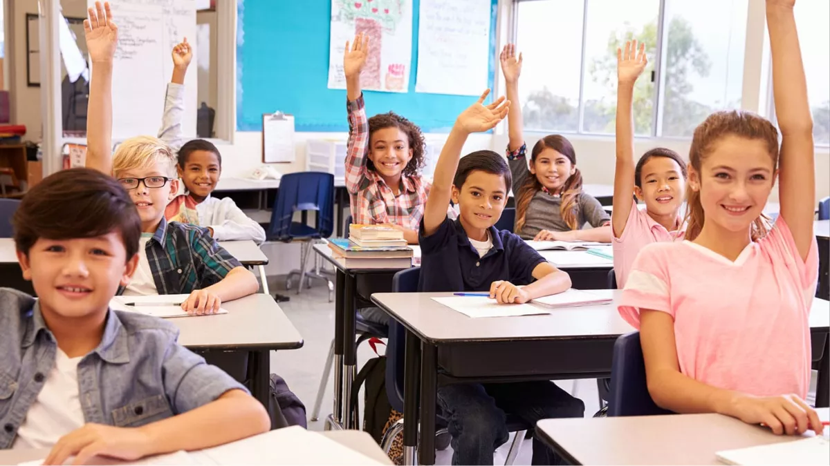 students raising their hands