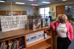 LaToya Morgan poses by bookshelves