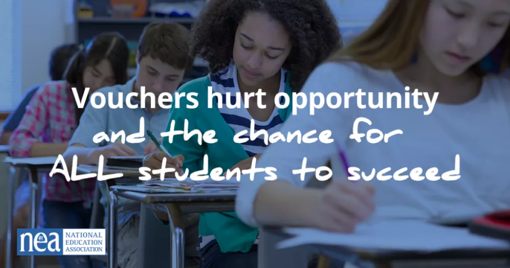 students work intently at their desks in class