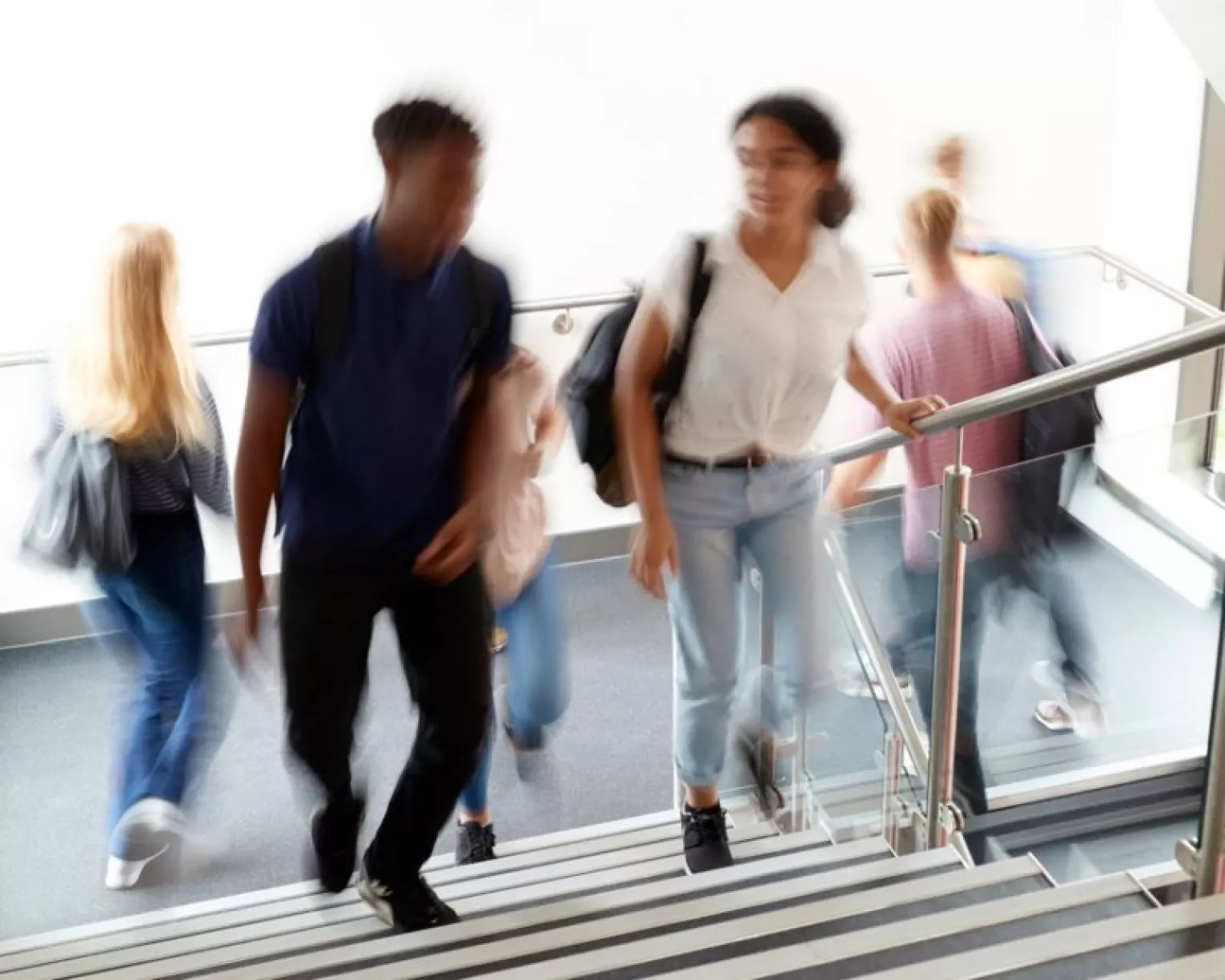 Students walking on staircase