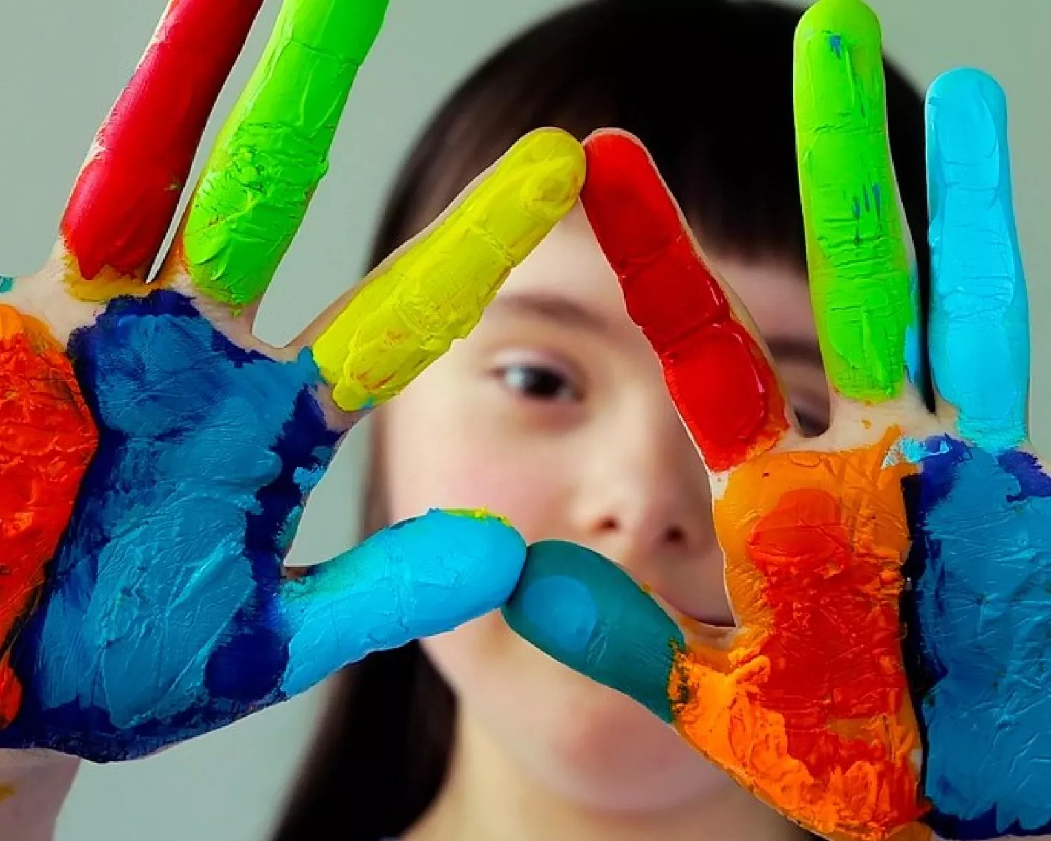 Student with paint on hands