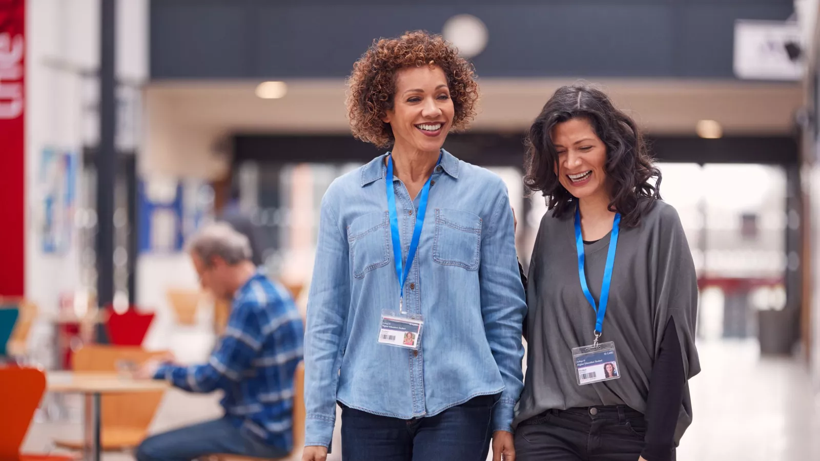 two teachers walking together in a conference hall