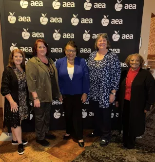 Vice-President Princess Moss poses with AEA leaders.