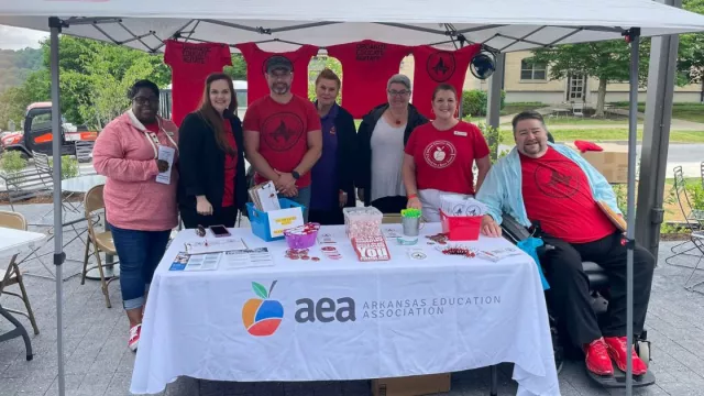 AEA Staff and Board at an AEA table at a picnic