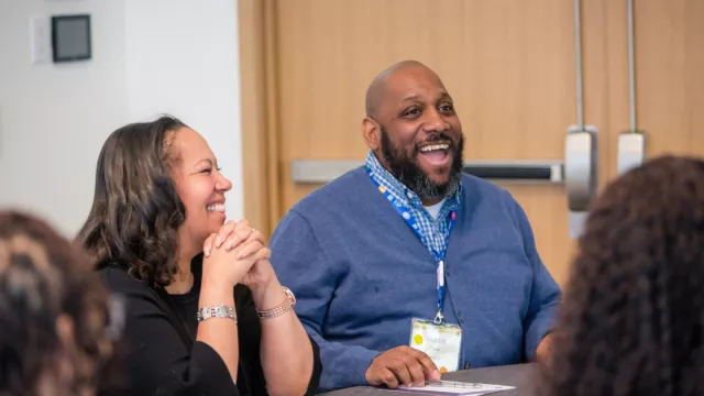ESPs at a professional development smiling and laughing together
